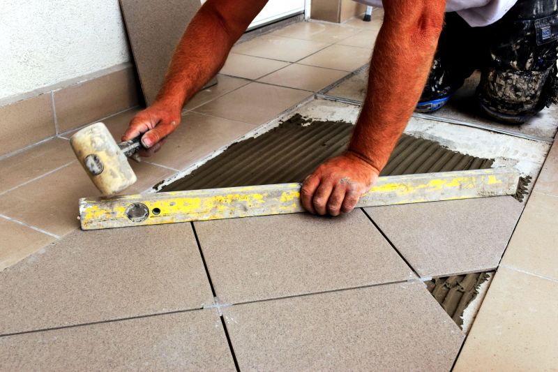 Skilled Tile Layer at Work
